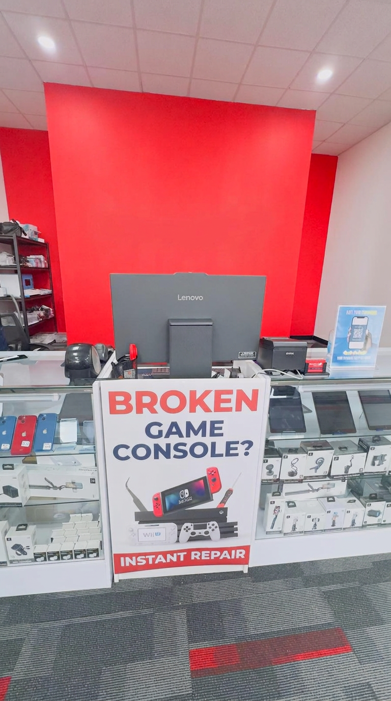Front counter with checkout, monitor, and product display cases